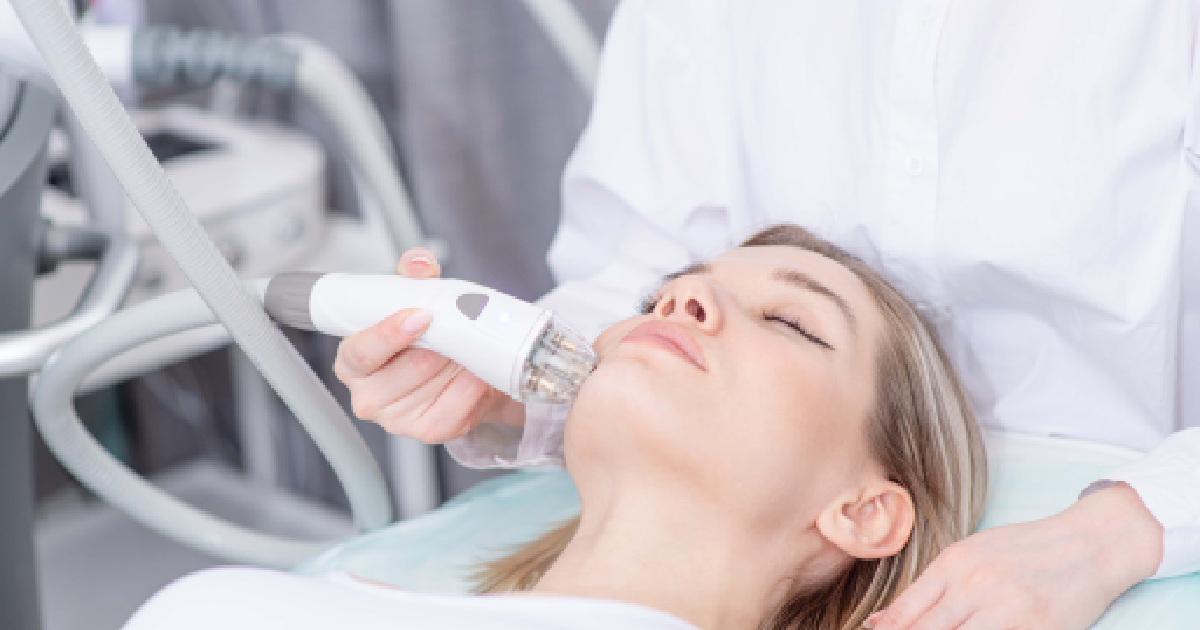 Thermage FLX treatment on woman's face in clinic in brookfield WI